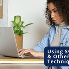 Lady typing an essay. Title: Use Synonyms and Other Writing Techniques