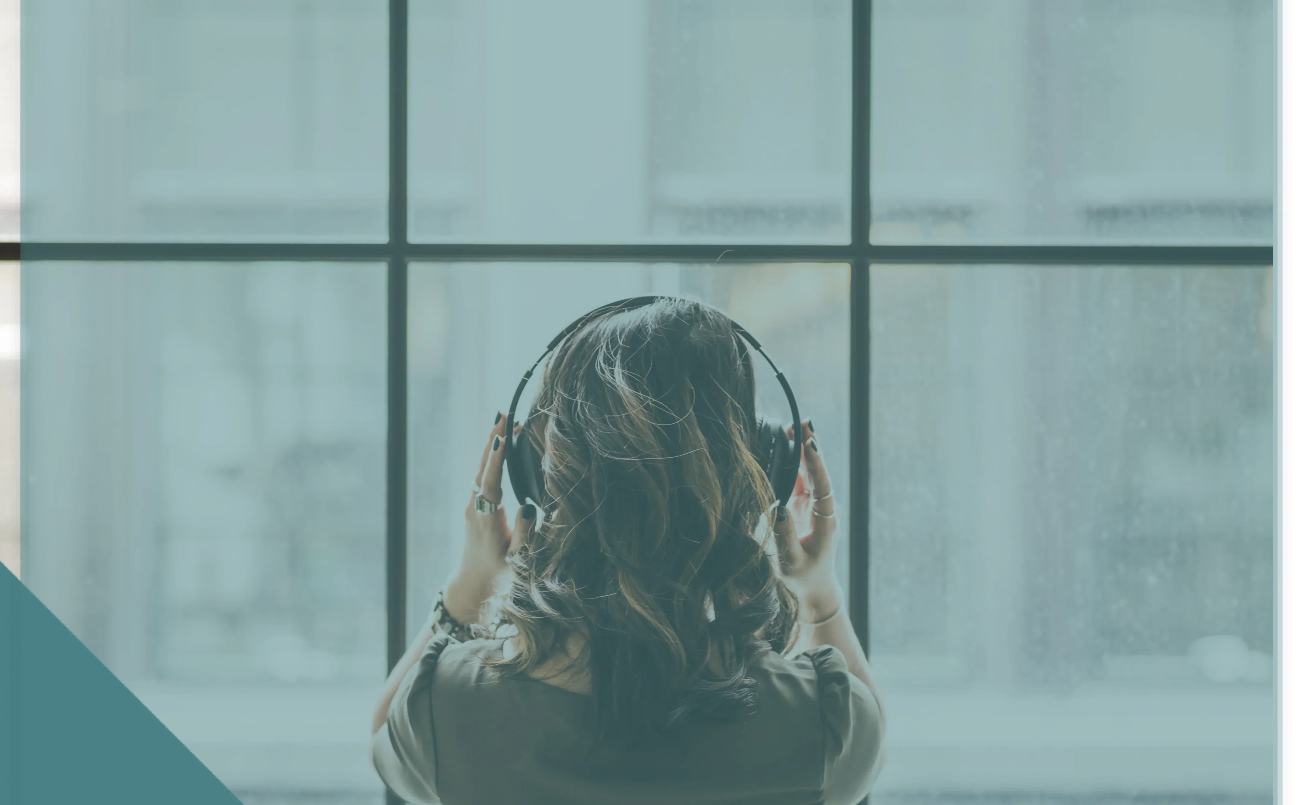 looking-out-window-wearing-headphones-1-1 1 (1)